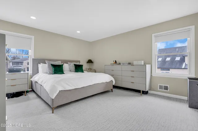 a bedroom with a bed and a cabinets