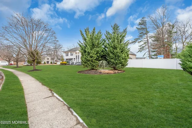 a view of a garden with a house