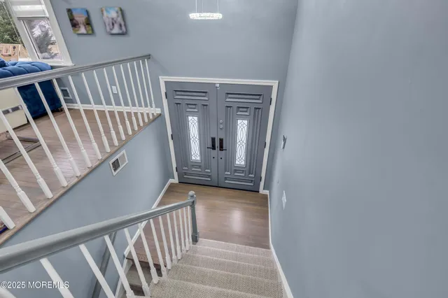 a view of a hallway with staircase