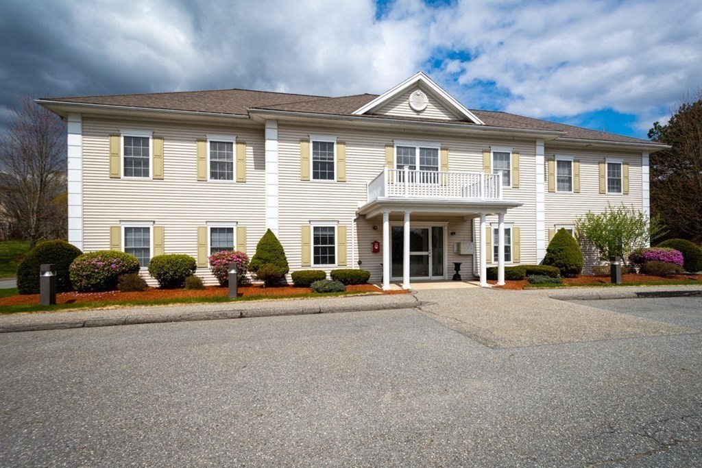 36 Webb Brook Road, Unit 4 Billerica, MA 01821 - Photo 1 of 21 front view of a house with a patio
