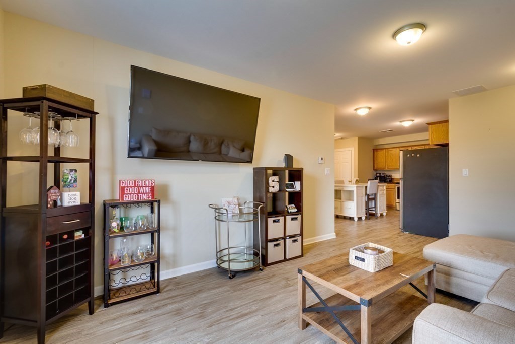 36 Webb Brook Road, Unit 4 Billerica, MA 01821 - Photo 12 of 21 a living room with furniture and a flat screen tv