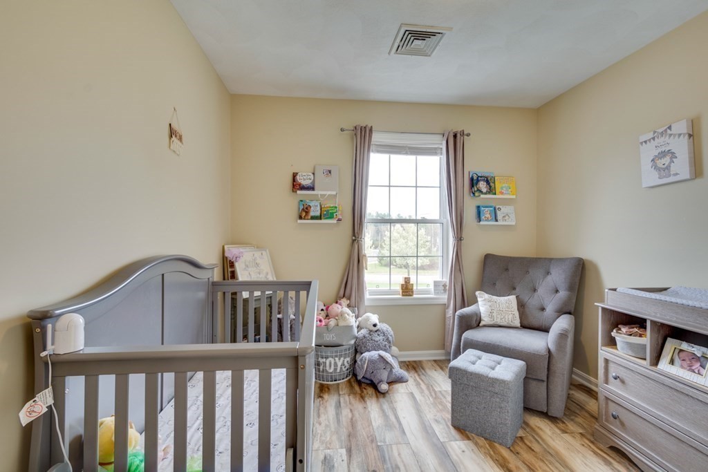 36 Webb Brook Road, Unit 4 Billerica, MA 01821 - Photo 15 of 21 a bedroom with furniture and a window