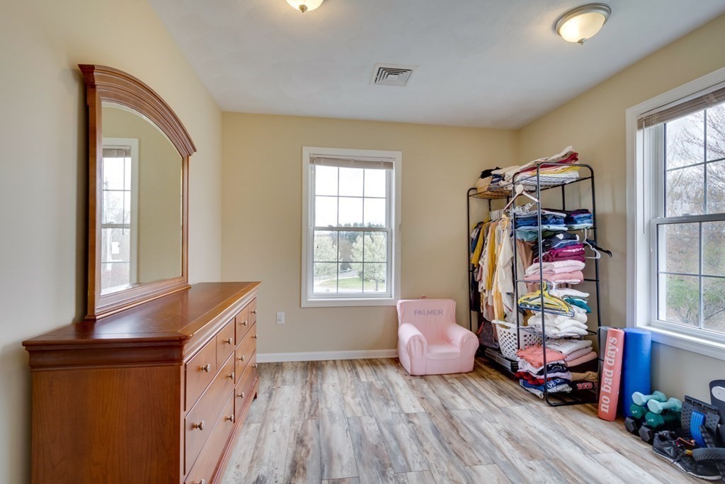 36 Webb Brook Road, Unit 4 Billerica, MA 01821 - Photo 16 of 21 a bedroom with furniture and a window