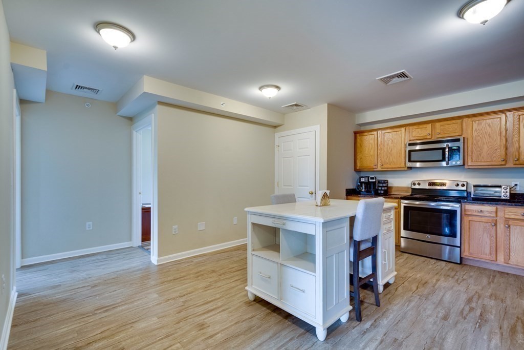 36 Webb Brook Road, Unit 4 Billerica, MA 01821 - Photo 7 of 21 a view of kitchen with sink microwave and stove