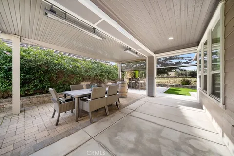 a view of a patio with couches chairs and potted plants