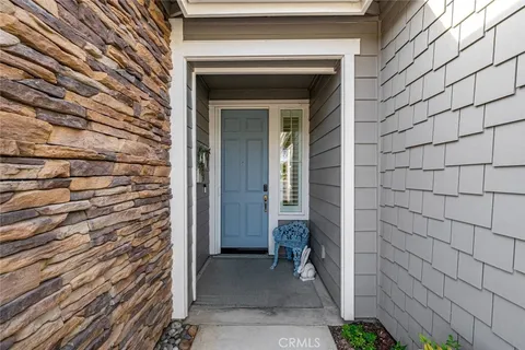 a living room with furniture fireplace and flat screen tv
