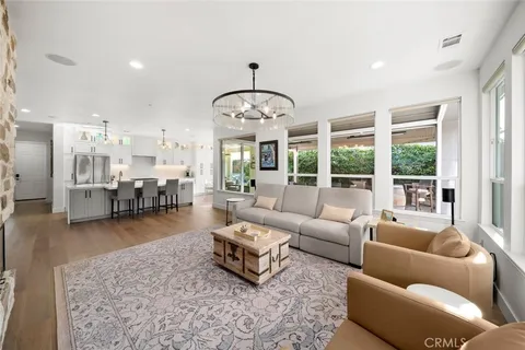 a dining room with furniture window wooden floor and garden view