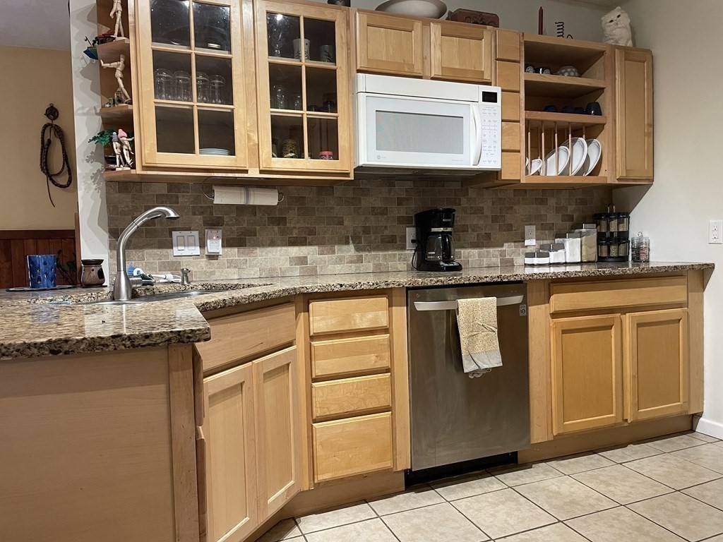 43 Madden Road West Brookfield, MA 01585 - Photo 8 of 21 a kitchen with stainless steel appliances granite countertop a stove and a microwave
