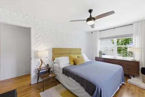 a bedroom with a bed and a window