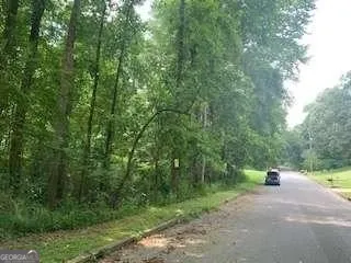 a view of a street with a trees