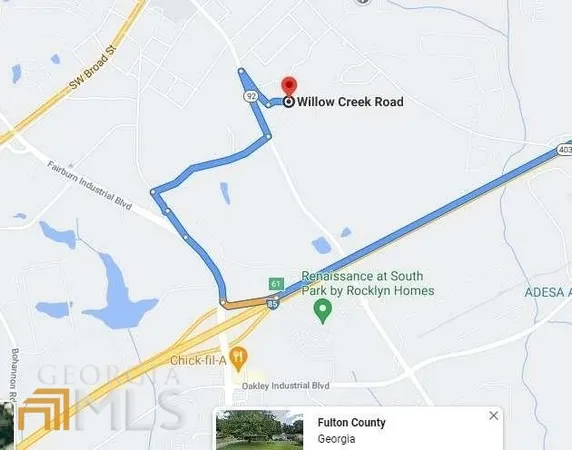 a view of a refrigerator with white wall