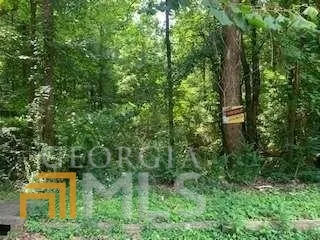 an aerial view of a house with lots of trees