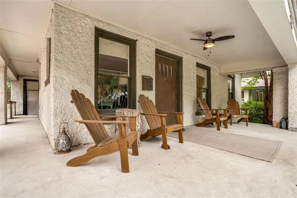 a view of a livingroom with furniture and a window