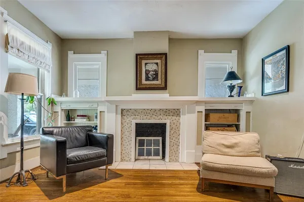 a living room with furniture and a fireplace