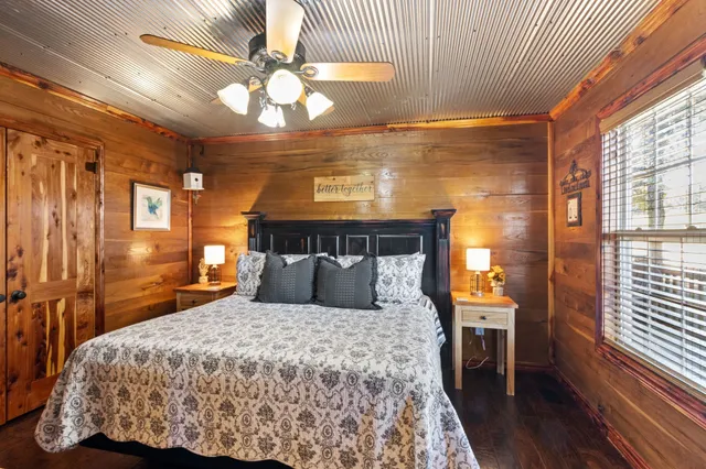 a bedroom with a bed and a chandelier