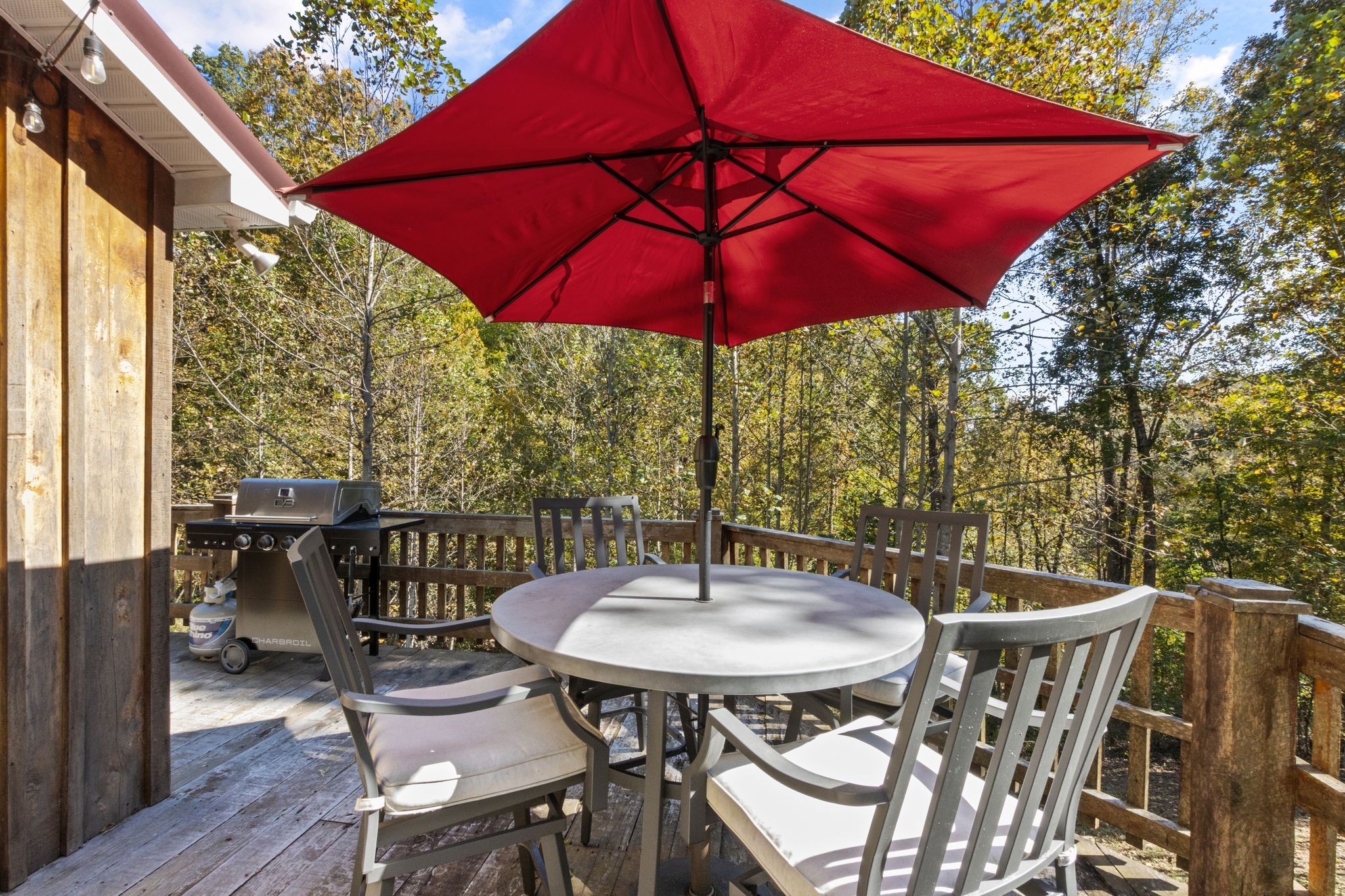 784 Damron Road Lynchburg, TN 37352 - Photo 22 of 38 a table and chairs in the balcony