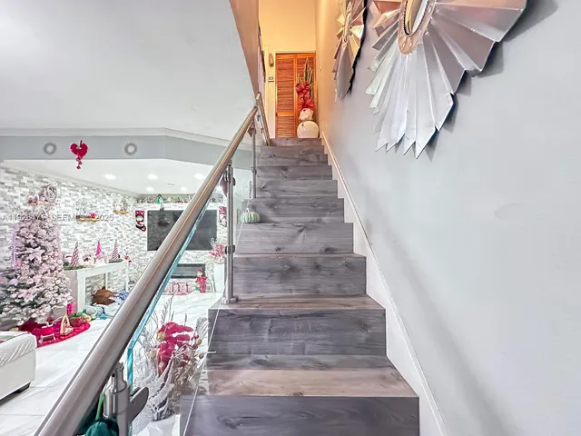 a bedroom with bed and a flat screen tv