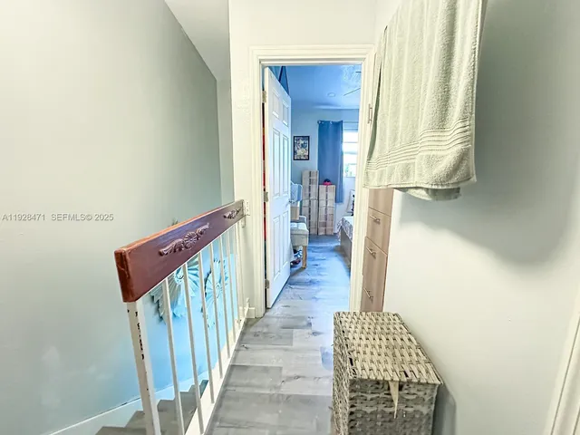 a bedroom with a bed a couch and a window