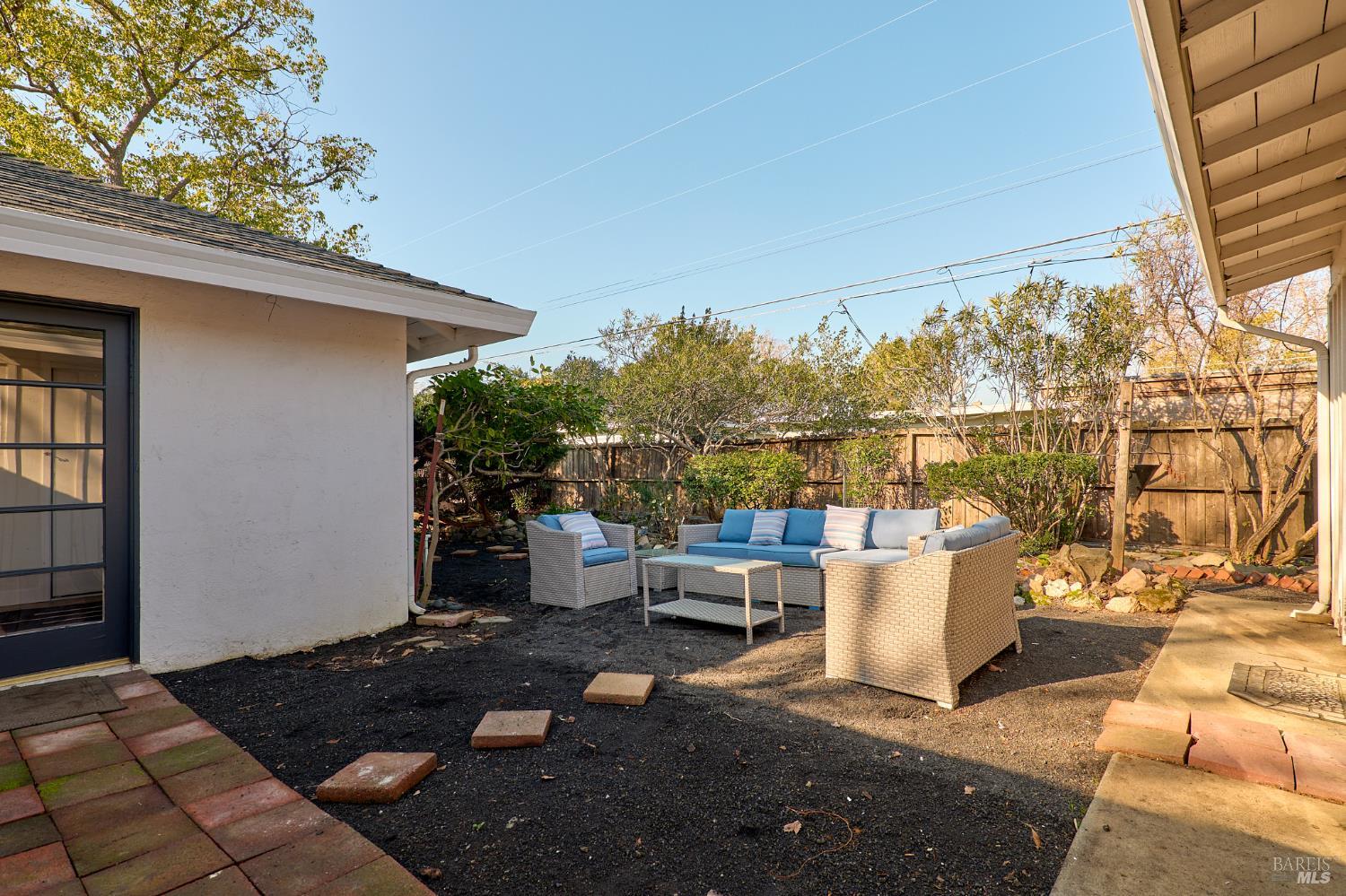 736 Nevada Street Fairfield, CA 94533 - Photo 31 of 36 a view of a patio with table and chairs and potted plants