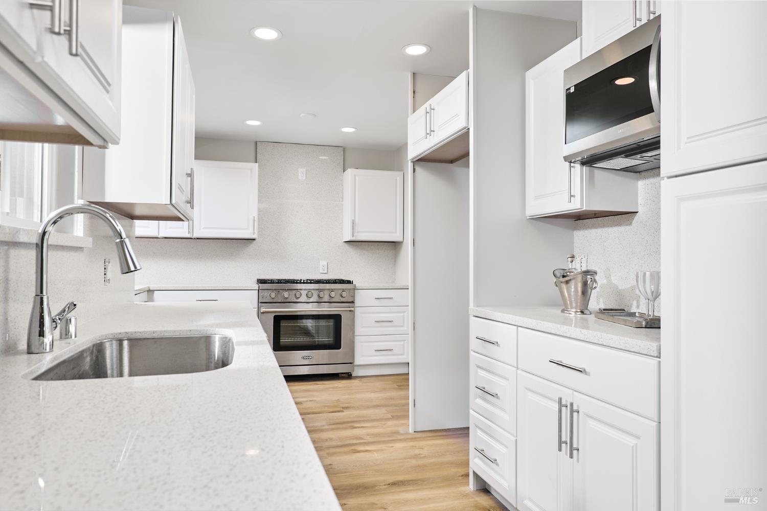 736 Nevada Street Fairfield, CA 94533 - Photo 7 of 36 a kitchen with stainless steel appliances granite countertop a sink stove and refrigerator