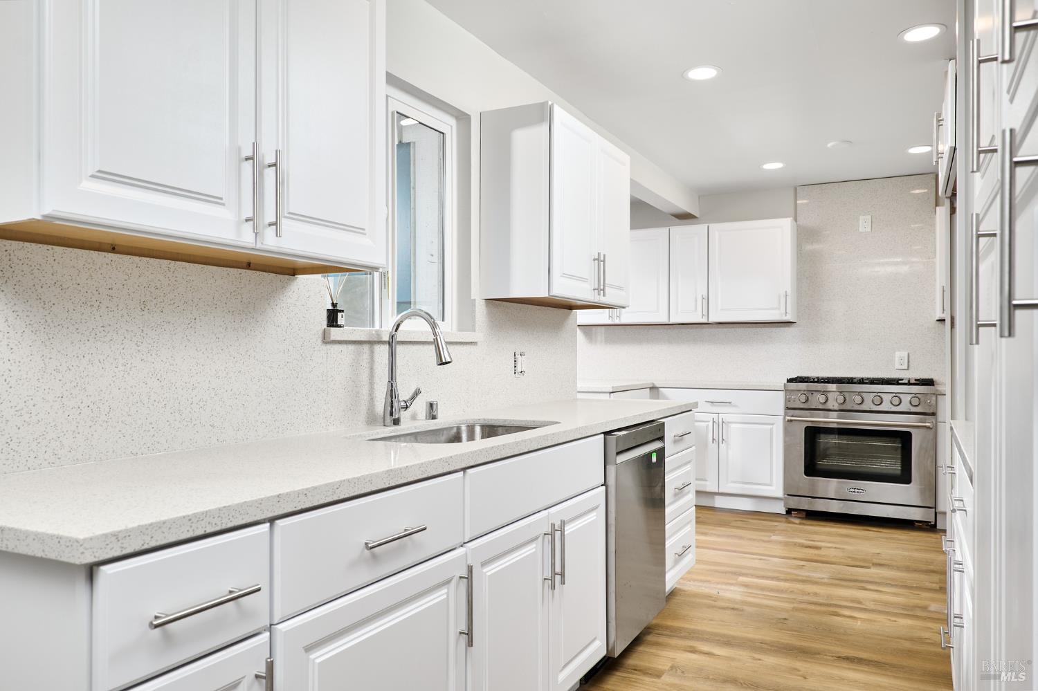 736 Nevada Street Fairfield, CA 94533 - Photo 8 of 36 a kitchen with a sink stove and cabinets