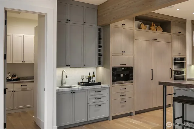 a kitchen with cabinets appliances and a counter space