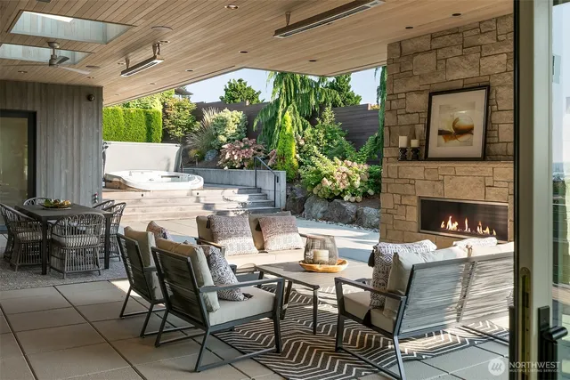 a outdoor space with patio fireplace and couches