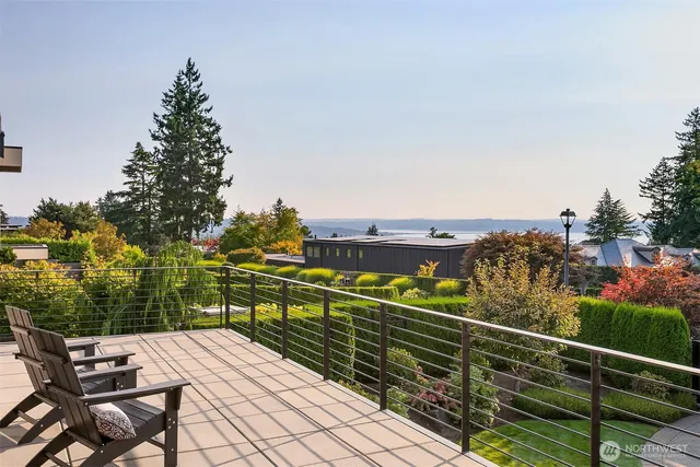 a view of a balcony with wooden floor and city view