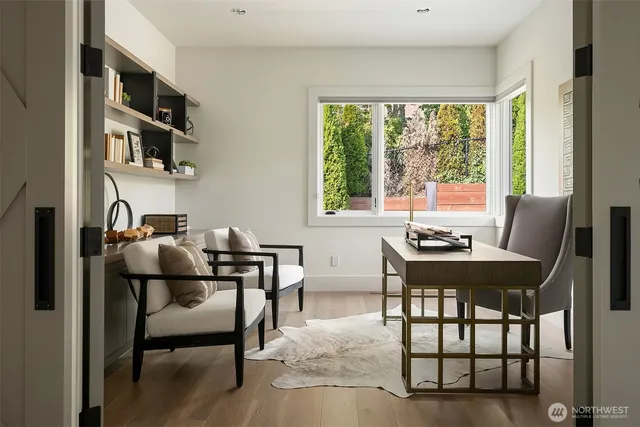a dining room with furniture and window