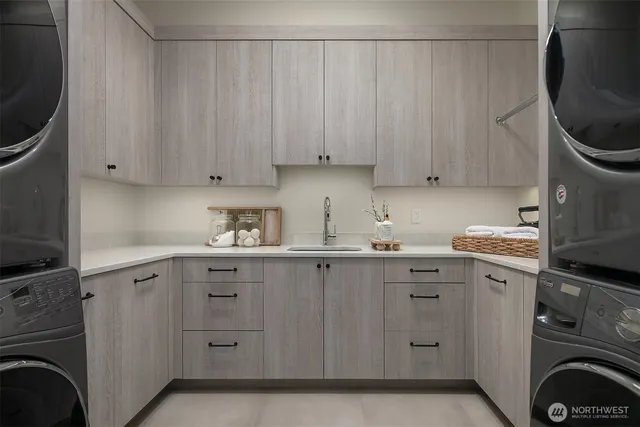 a kitchen with sink cabinets and washer