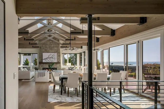 a view of a dining room with furniture wooden floor and chandelier