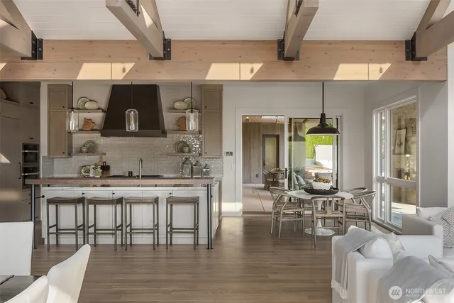 a large kitchen with a table and chairs