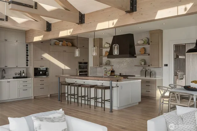 a kitchen with a stove a sink and a refrigerator