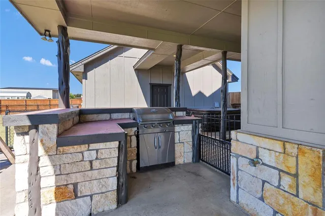 a kitchen with a stove and a microwave