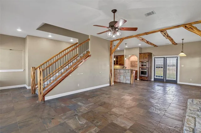 a view of a livingroom with a ceiling fan