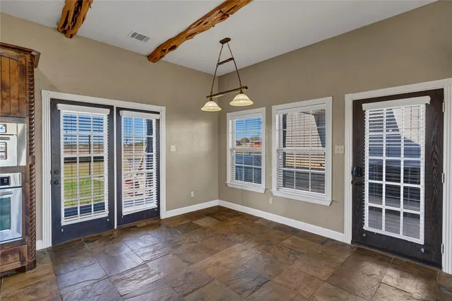 a view of empty room with windows