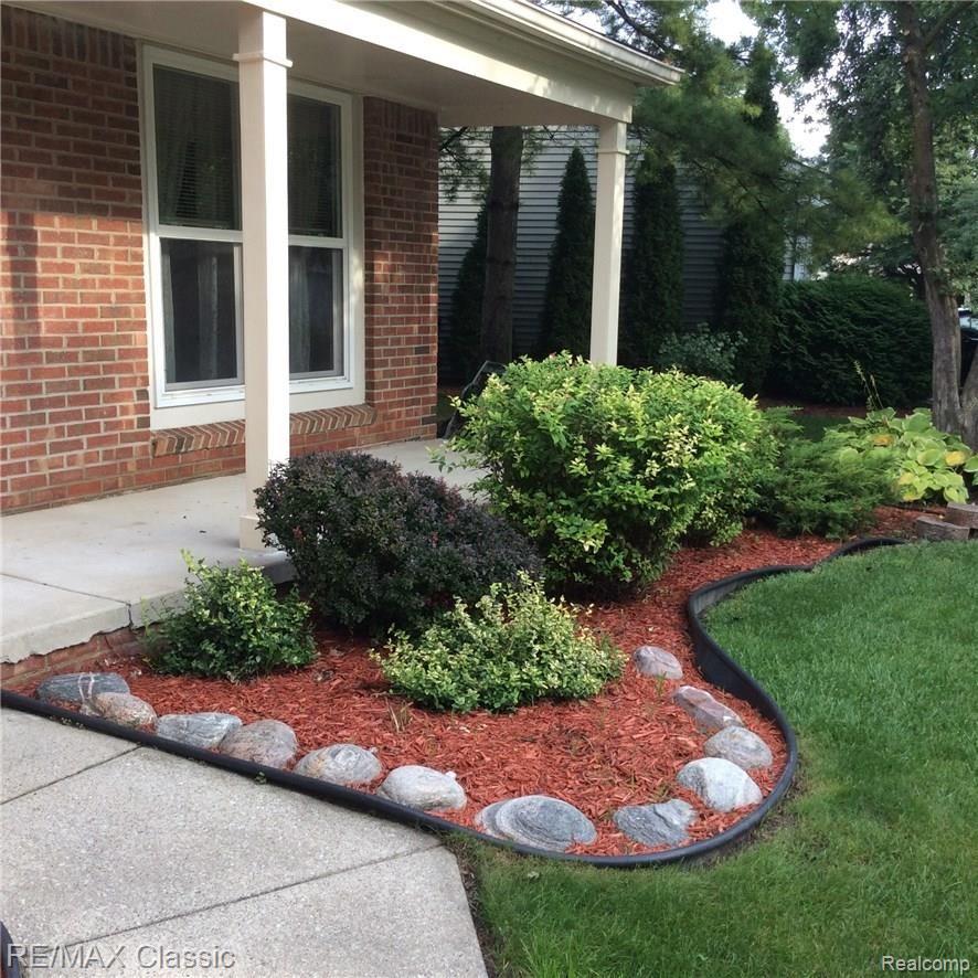 704 Burlington Road Canton, MI 48188 - Photo 4 of 40 Covered front porch and low maintenance landscaping