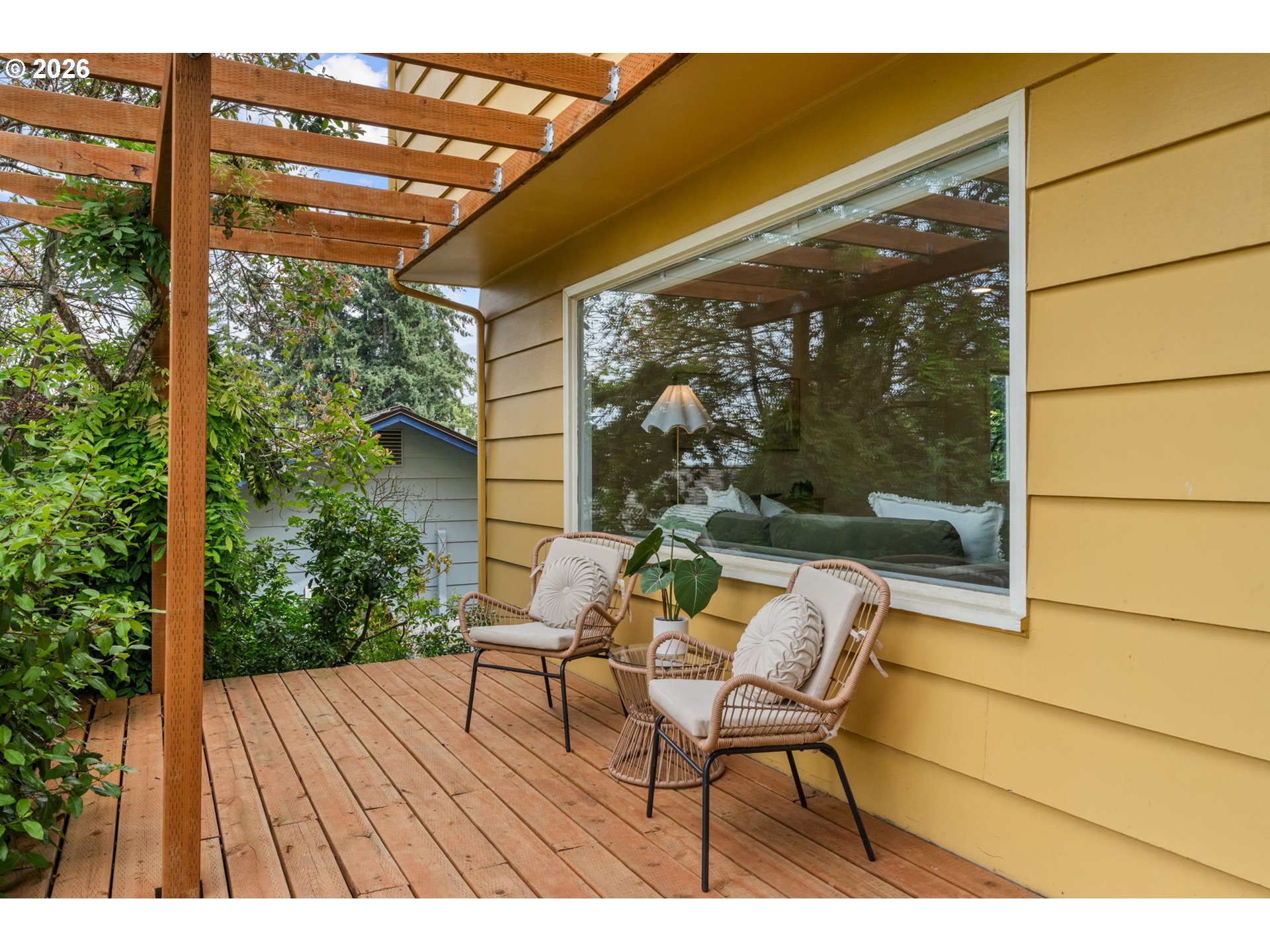 1995 Greiner Street Eugene, OR 97405 - Photo 3 of 39 a balcony with wooden floor table and chairs