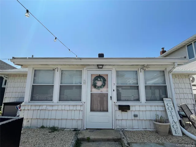 front view of a house with large windows