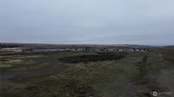 a view of a city street with an ocean view
