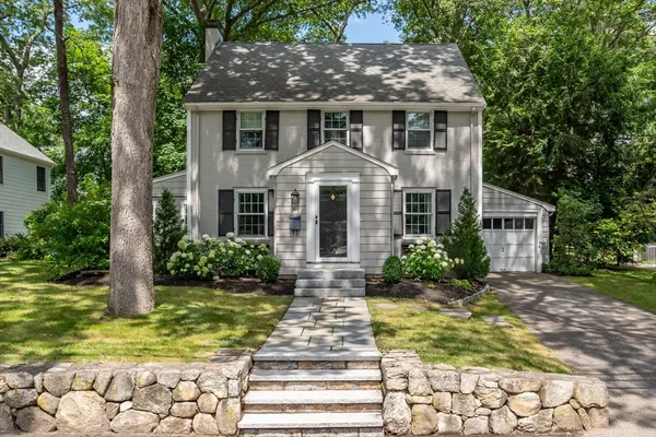 a front view of a house with garden