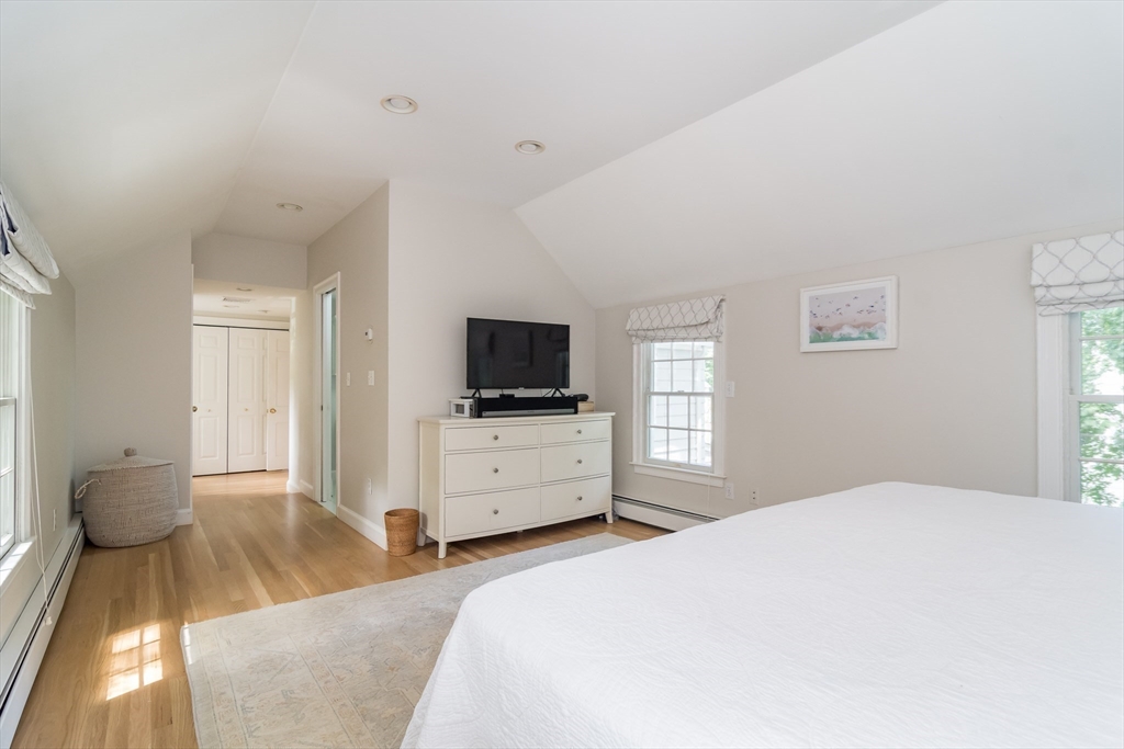 31 Martin Road Wellesley, MA 02481 - Photo 15 of 28 a bedroom with a bed and a flat screen tv