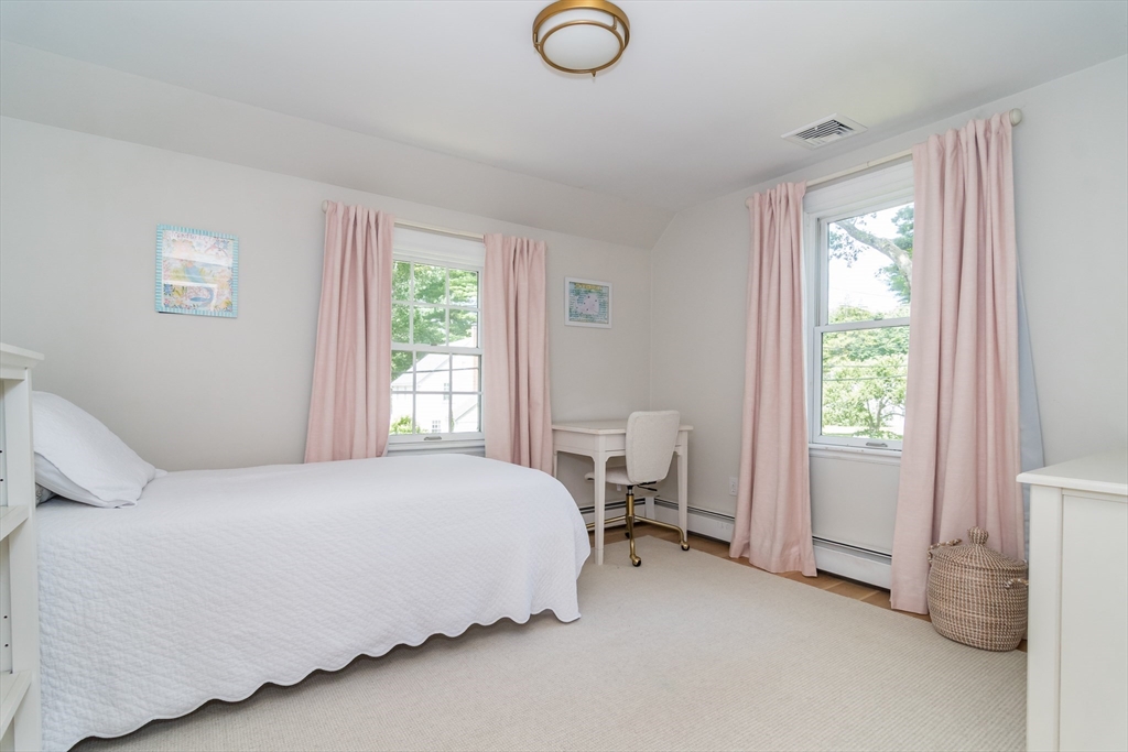 31 Martin Road Wellesley, MA 02481 - Photo 17 of 28 a bedroom with a bed and a window