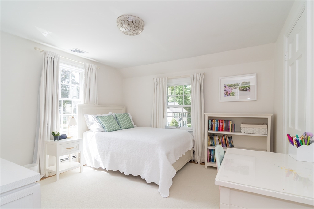 31 Martin Road Wellesley, MA 02481 - Photo 18 of 28 a bedroom with a bed and a large window