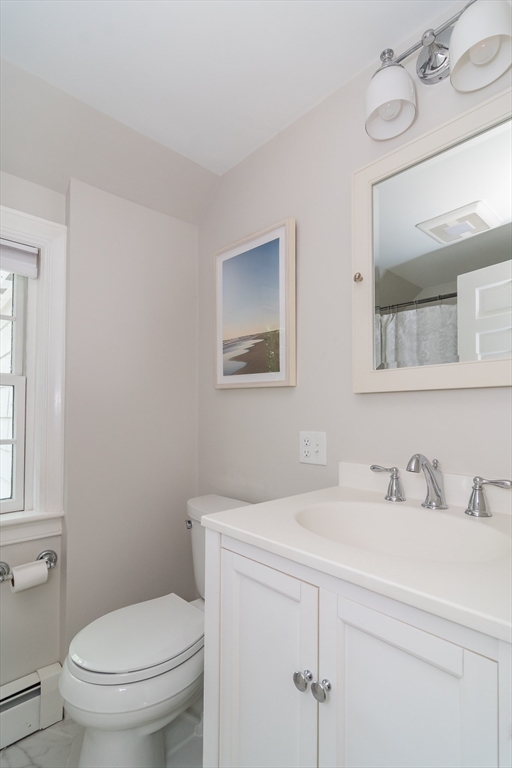 31 Martin Road Wellesley, MA 02481 - Photo 20 of 28 a bathroom with a toilet sink and mirror