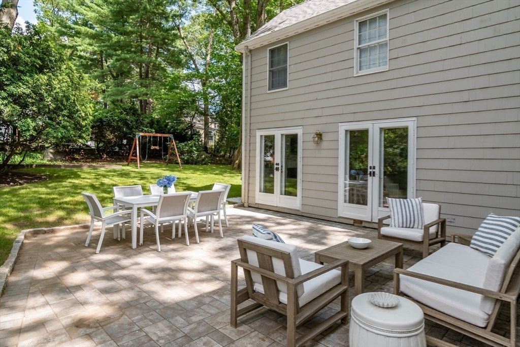 31 Martin Road Wellesley, MA 02481 - Photo 23 of 28 a view of a patio with table and chairs and potted plants