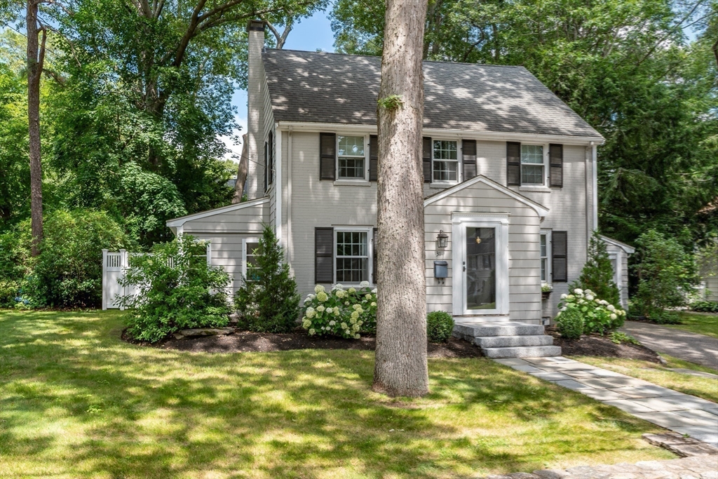 31 Martin Road Wellesley, MA 02481 - Photo 27 of 28 a front view of house with yard and green space