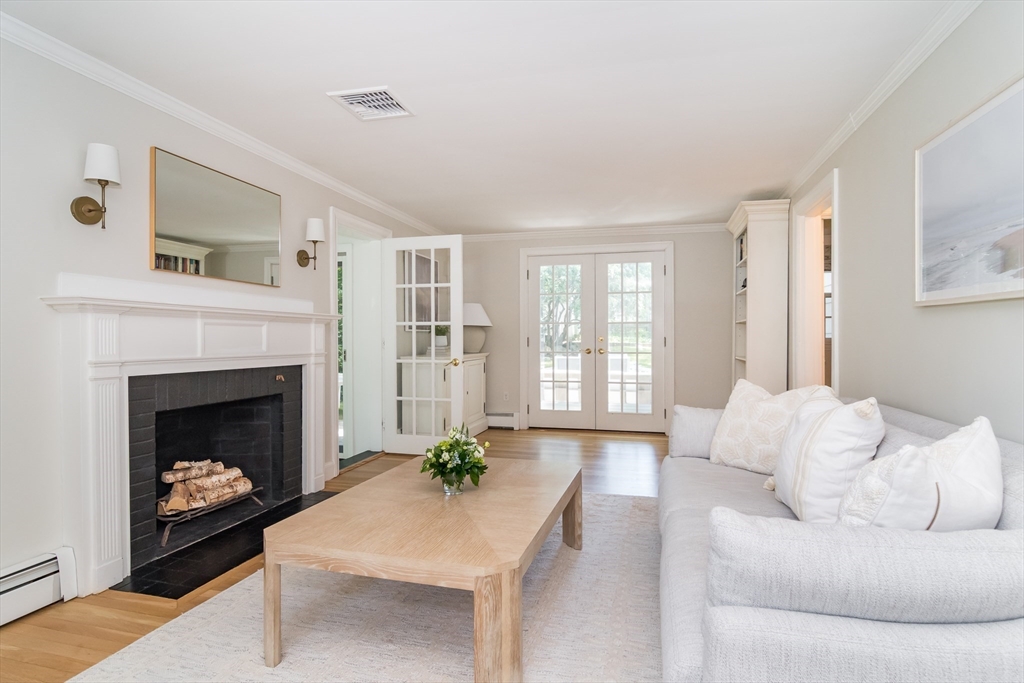 31 Martin Road Wellesley, MA 02481 - Photo 3 of 28 a living room with furniture and a fireplace