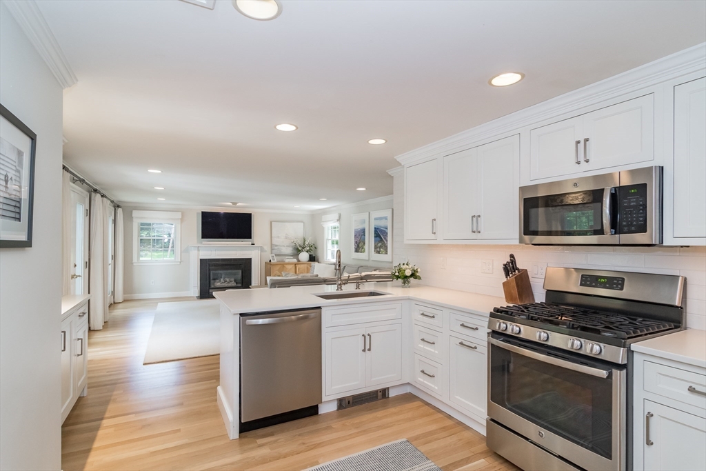 31 Martin Road Wellesley, MA 02481 - Photo 7 of 28 a kitchen with a stove a sink and a microwave
