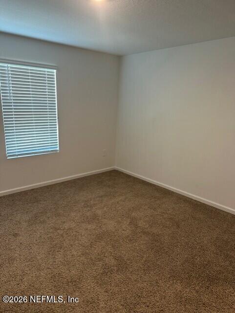 915 Rivertree Place Middleburg, FL 32068 - Photo 20 of 23 an empty room with a window